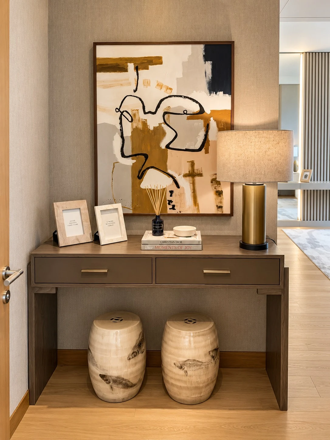 Bvlgari Residences II — Illuminated joinery frames a considered arrangement of sculptural objects and collected books.
