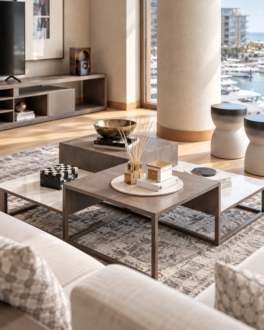 Bvlgari Residences I — Layered tables and sculptural objects create a balanced centrepiece within the living room.