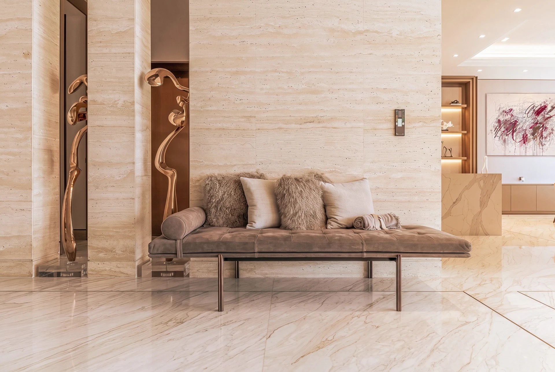 Jumeirah Bay Island Mansion — Travertine, bronze and quiet restraint compose a serene moment of arrival.